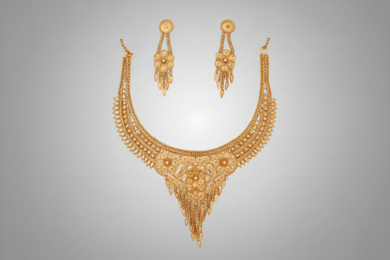 Ornate necklace and earrings set on a black background