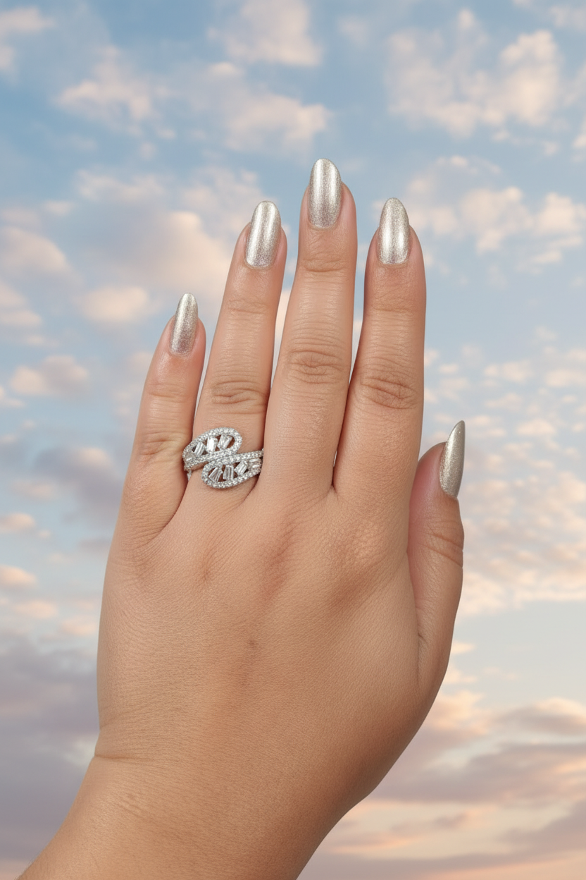 Hand wearing a ring with a blue light on a dark background