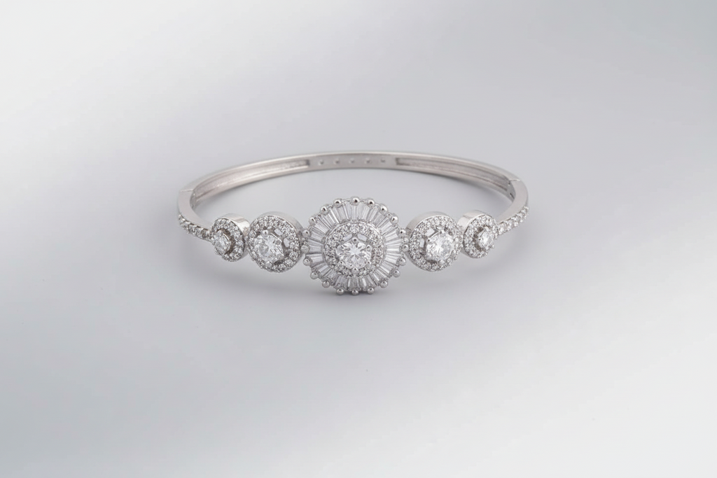 Silver bracelet with multiple round diamonds on a black textured background