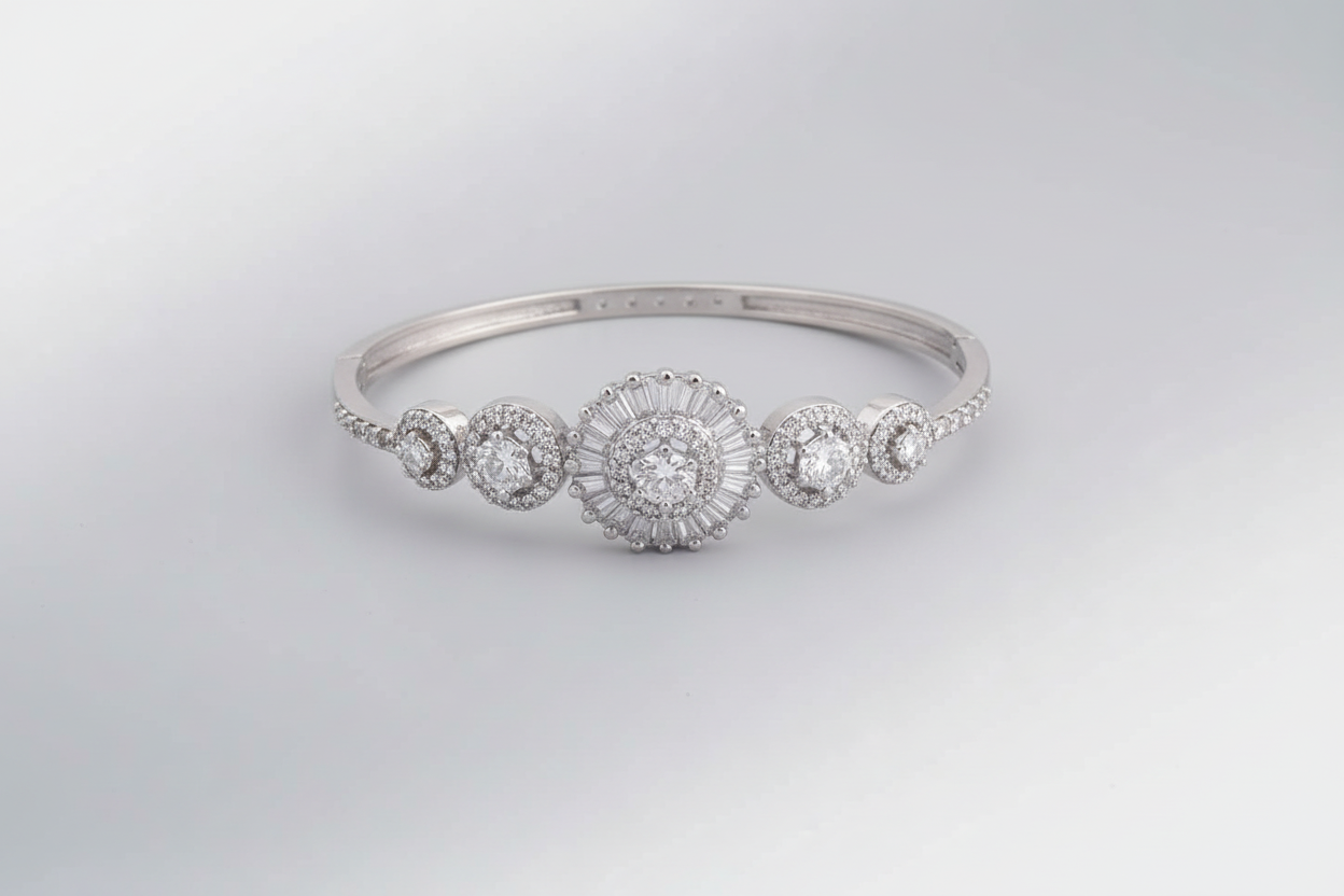Silver bracelet with multiple round diamonds on a black textured background