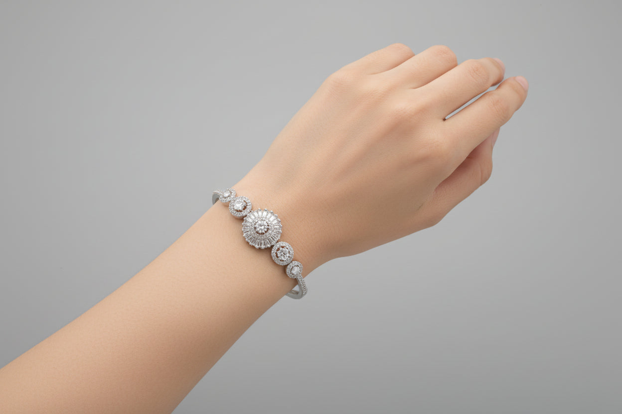 Silver bracelet with multiple round diamonds on a black textured background